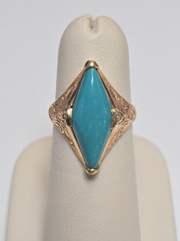 18K gold ring featuring a marquise turquoise gemstone, crafted by Chique Jewelry, weighing 4.1 grams.