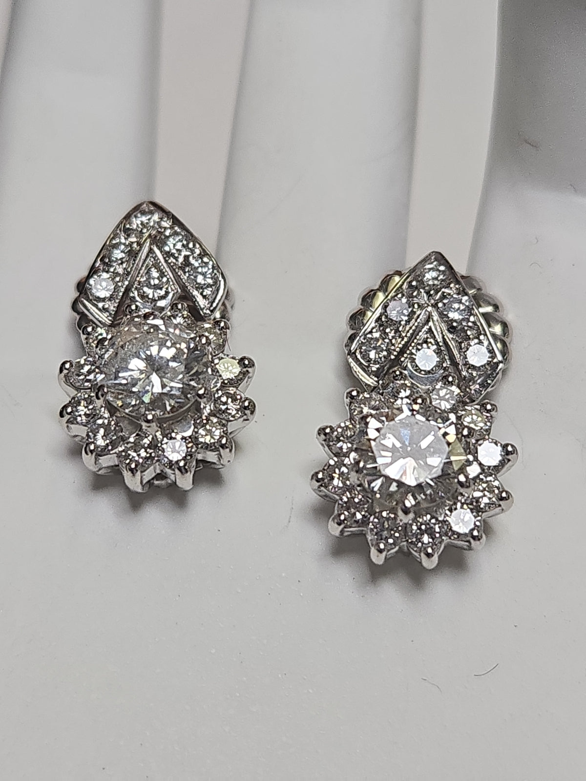 14K white gold stud earrings with 2.4ct round diamonds, featuring elegant jewelry design and a secure post backing.