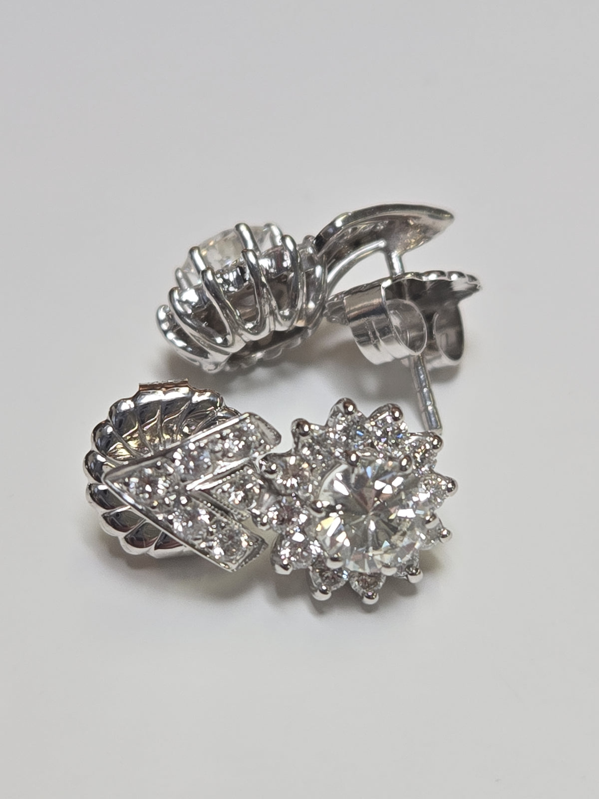 14K white gold stud earrings with 2.4ct round diamonds from Chique Jewelry, featuring a sleek and elegant design.