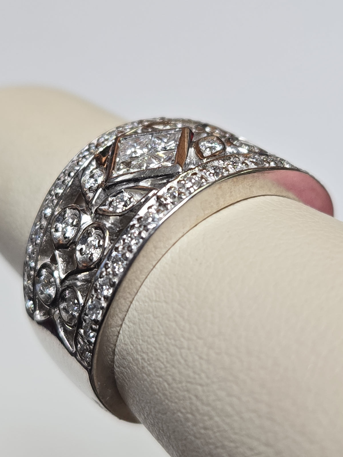 14K white gold ring with 0.33ct princess-cut diamonds, elegant jewelry by Chique Jewelry featuring a sleek design.