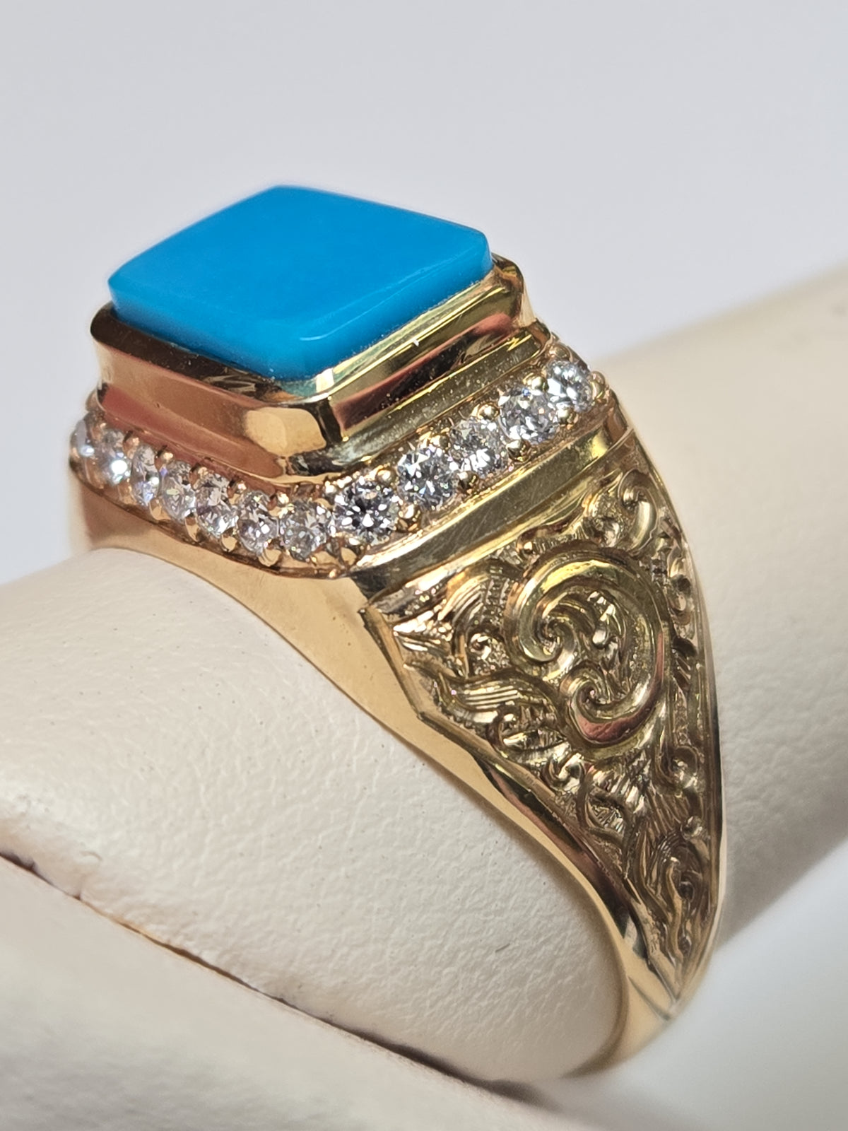 18K gold ring with rectangular Persian turquoise stone, designed by Chique Jewelry, showcasing intricate craftsmanship.