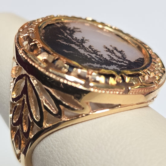 14K gold filigree ring with round agate gemstone, featuring intricate design and weighing 6.6 grams.
