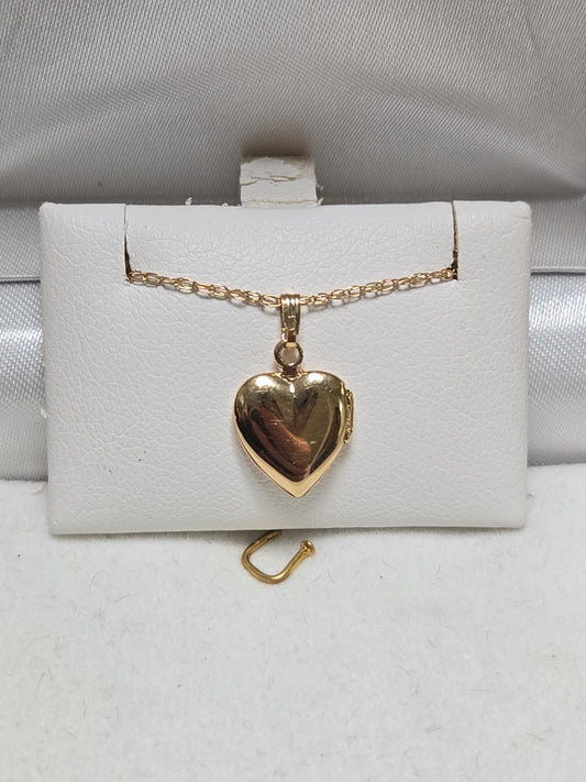 14K gold heart locket pendant from Chique Jewelry, 1g, featuring a delicate design and polished finish.
