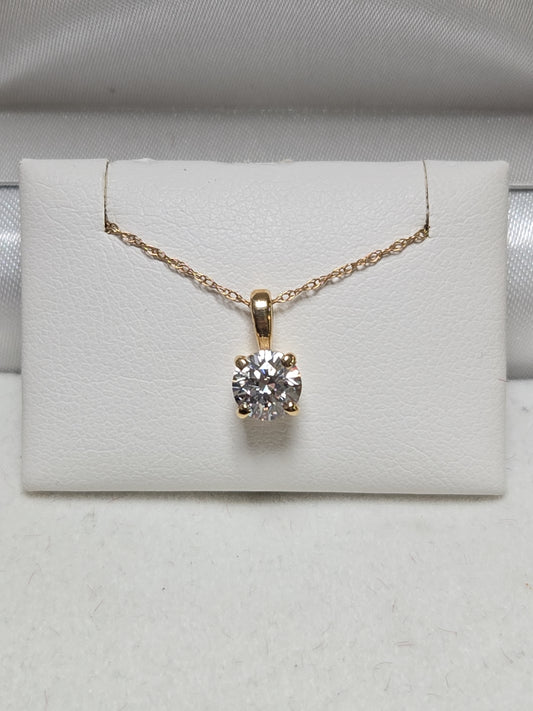 14K gold pendant with round simulated Lannyte diamond, weighing 0.7g, by Chique Jewelry, displayed on a neutral background.
