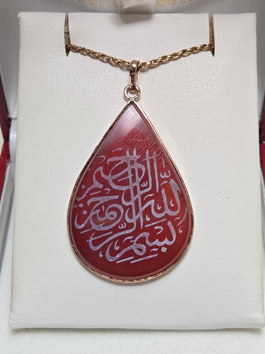 18K gold Islamic passage pendant with pear-shaped carnelian gemstone, weighing 5.1g, from Chique Jewelry.