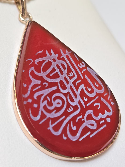 Pear-shaped Carnelian Islamic passage pendant in 18K gold, weighing 5.1g, from Chique Jewelry.