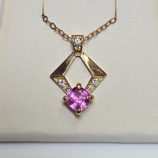 14K gold pendant featuring a 1.3ct cushion-cut pink sapphire, crafted by Chique Jewelry, with a total weight of 2.4 grams.