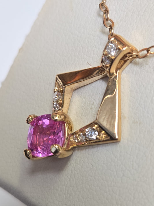 14K gold pendant featuring a 1.3ct cushion-cut pink sapphire, weighing 2.4g, from Chique Jewelry.