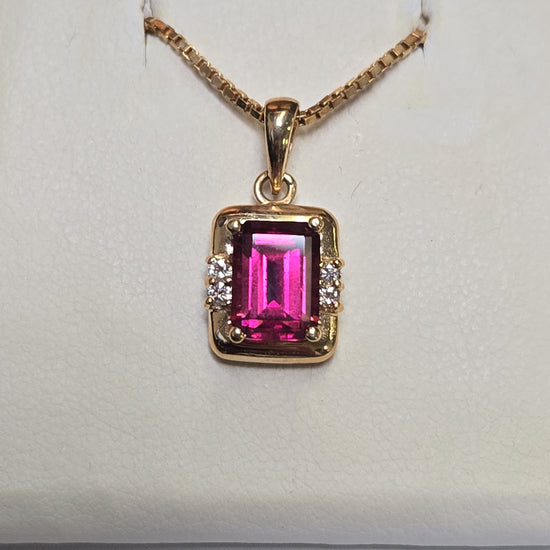 14K gold pendant featuring an emerald-cut rubelite gemstone, weighing 2.7 grams, from Chique Jewelry.