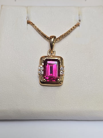 14K gold pendant featuring an emerald-cut rubelite gemstone, weighing 2.7 grams, from Chique Jewelry.
