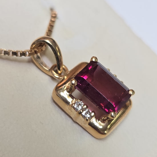 14K gold pendant with emerald-cut rubellite gemstone, weighing 2.7 grams, from Chique Jewelry.