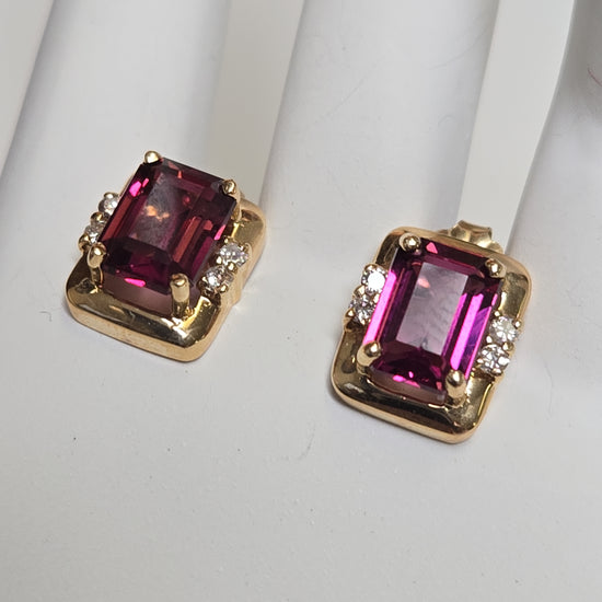 14K gold pendant featuring an emerald-cut rubelite gemstone, crafted by Chique Jewelry, weighing 3.5 grams.
