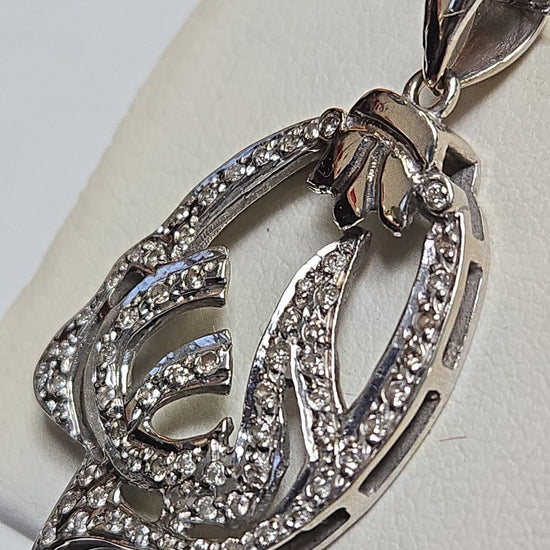 18K white gold Allah pendant with round diamonds, elegant jewelry piece by Chique Jewelry, showcasing intricate design and sparkling stones.