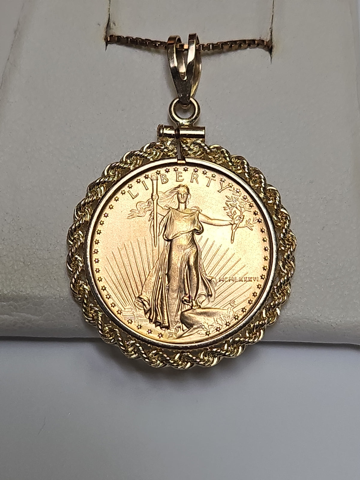 14K gold American Gold Eagle 1986 1/4 oz coin pendant featuring detailed gold eagle design, crafted by Chique Jewelry.