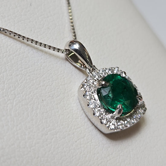 18K white gold pendant with a 0.76ct round emerald, weighing 1.6g, from Chique Jewelry.