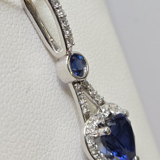 14K white gold heart-shaped pendant with 1.5ct simulated blue sapphire from Chique Jewelry, showcasing elegant jewelry design.