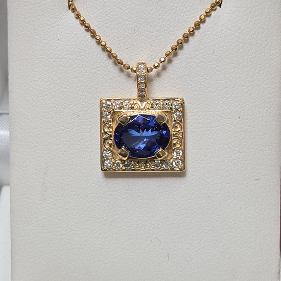 14K gold pendant featuring a 2.44ct oval Tanzanite gemstone, designed by Chique Jewelry, with a sleek and elegant style.