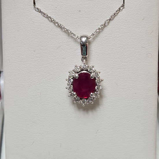 14K white gold pendant featuring a 1.5ct oval ruby, weighing 2.7g, from Chique Jewelry.