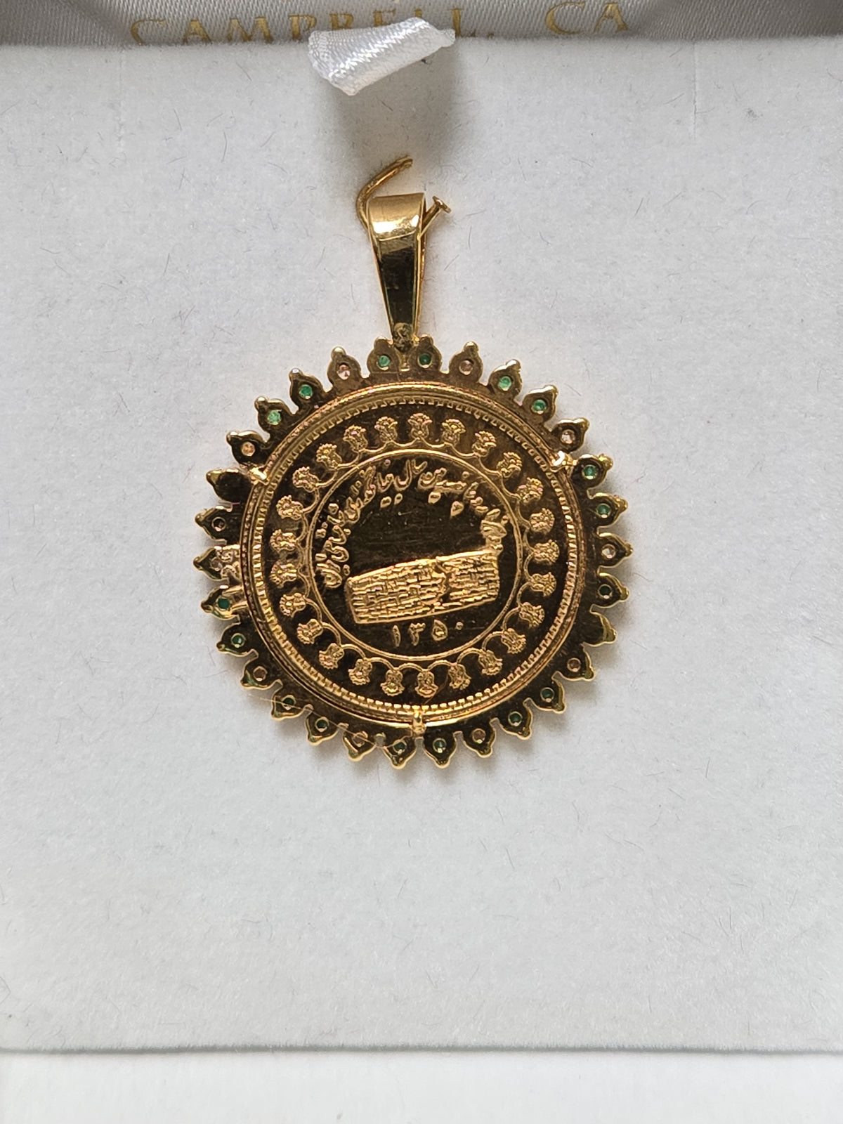 14K gold Mohammad Reza Shah Pahlavi coin pendant with 0.5ct round emeralds, crafted by Chique Jewelry, weighing 12.3 grams.