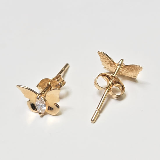 14K gold stud earrings with round cubic zirconia stones, featuring a minimalist design and a total weight of 0.4 grams.