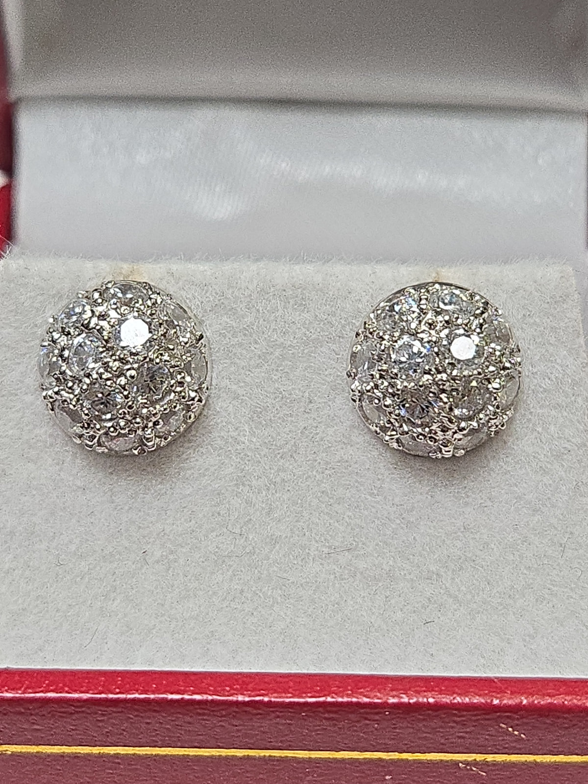 18K white gold cluster stud earrings with round cubic zirconia gemstones, showcasing sparkling jewelry design.