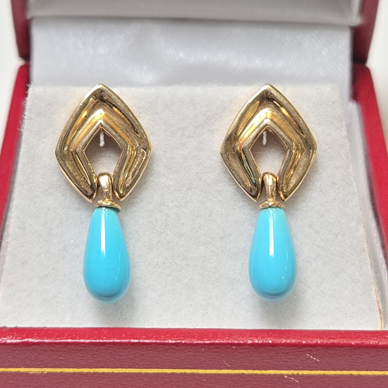 14K gold drop earrings featuring pear-shaped turquoise stones, weighing 2.7g, from Chique Jewelry.