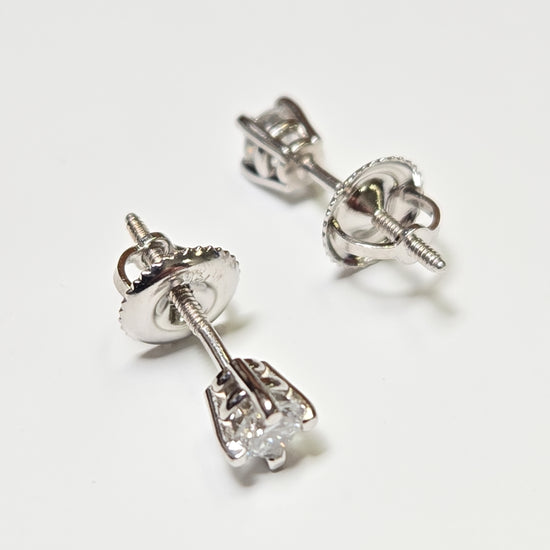 14K white gold stud earrings with 0.3ct round lab-created diamonds, featuring a sleek design from Chique Jewelry.