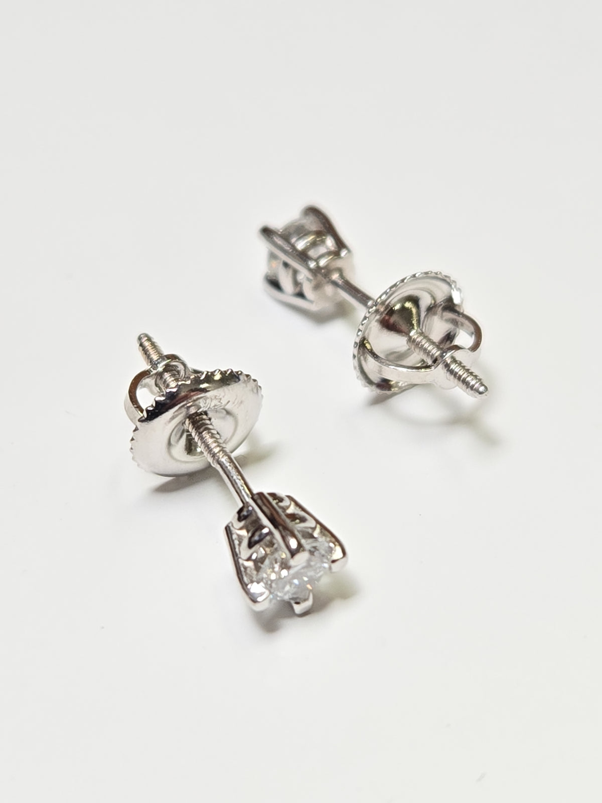 14K white gold stud earrings with 0.3ct round lab-created diamonds, featuring a sleek design from Chique Jewelry.