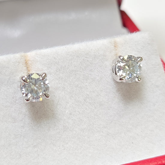 14K white gold stud earrings featuring 0.95ct round lab-created diamonds from Chique Jewelry, showcased on a white background.