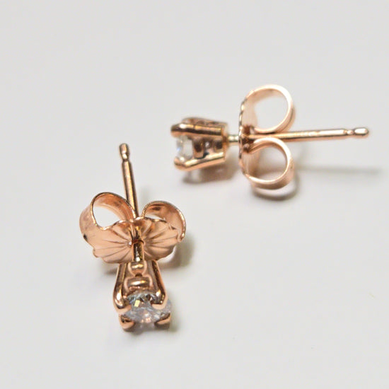 14K rose gold stud earrings with 0.26ct round diamonds from Chique Jewelry, featuring a sleek and elegant design.