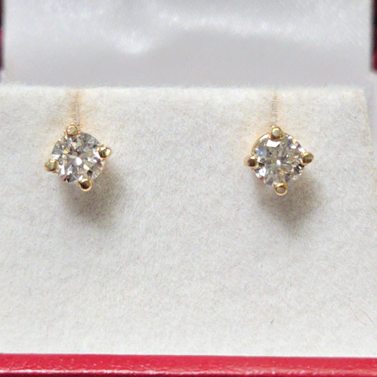 14K gold stud earrings with 0.66ct round lab-created diamonds from Chique Jewelry, featuring a sleek and elegant design.