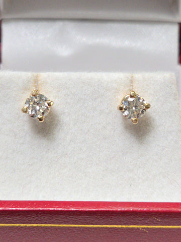 14K gold stud earrings with 0.66ct round lab-created diamonds from Chique Jewelry, featuring a sleek and elegant design.