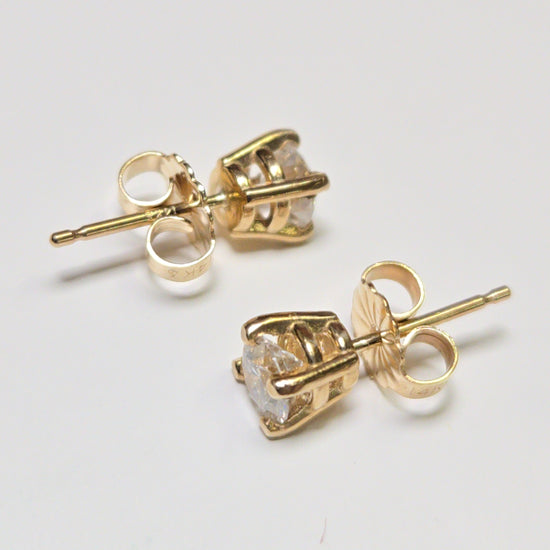 14K gold stud earrings with 0.66ct round lab-created diamonds from Chique Jewelry, featuring a sleek and elegant design.