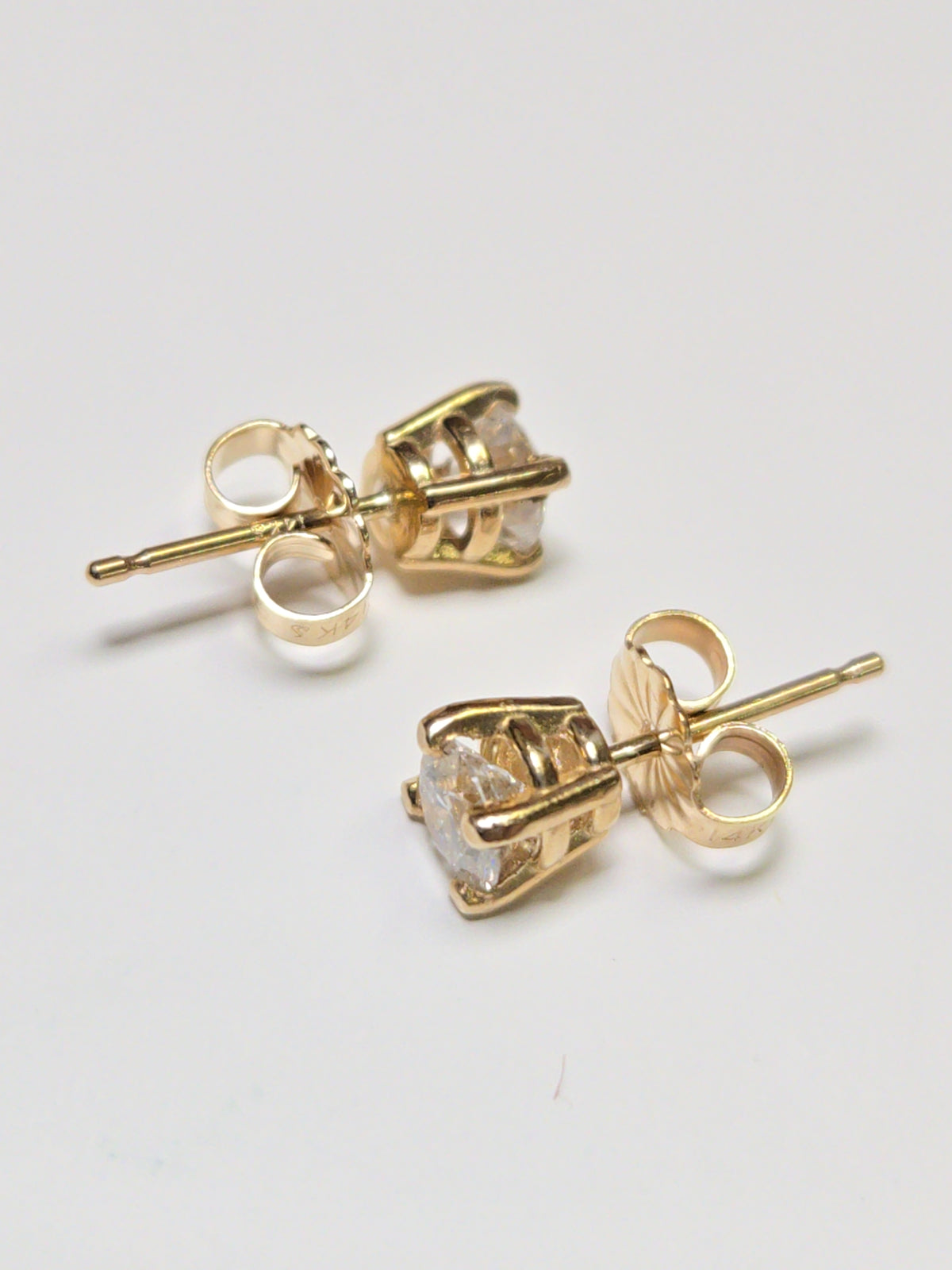 14K gold stud earrings with 0.66ct round lab-created diamonds from Chique Jewelry, featuring a sleek and elegant design.