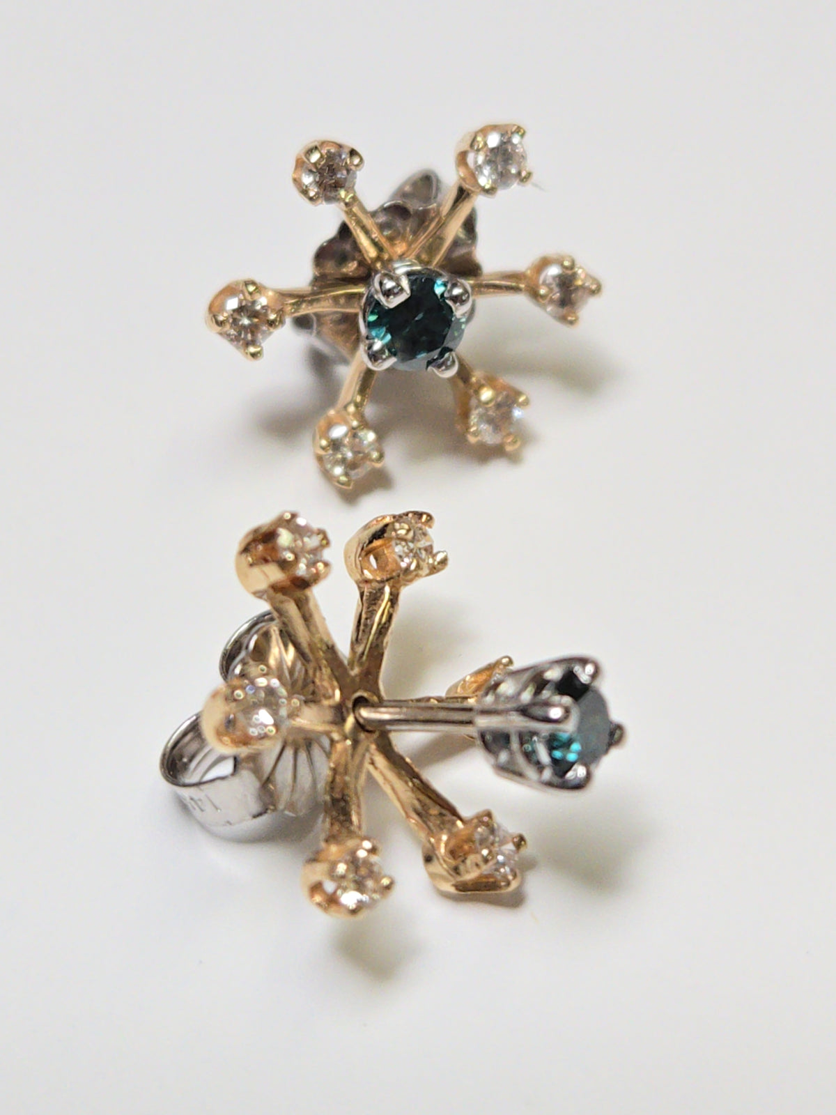 14K gold earring jackets with 0.2ct round diamonds from Chique Jewelry, showcasing elegant jewelry design.