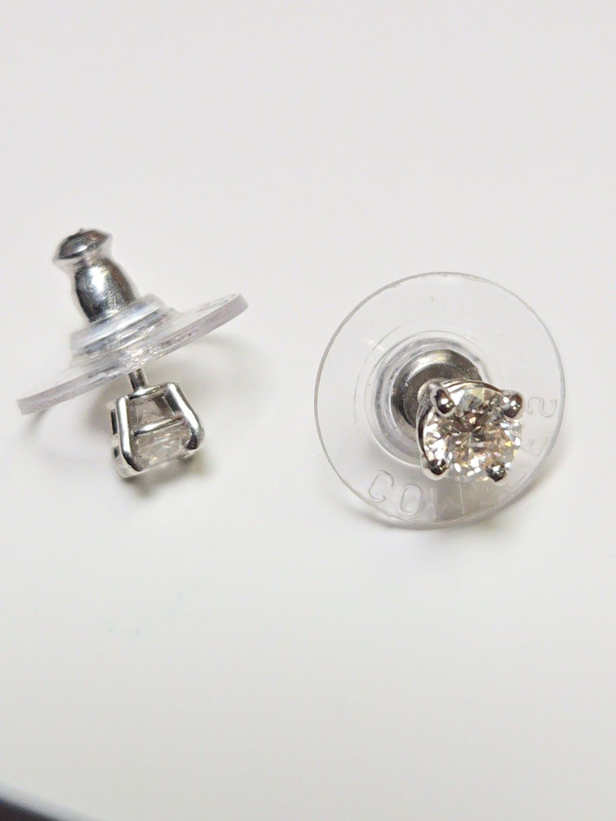 14K white gold stud earrings with 0.66ct round diamonds from Chique Jewelry, featuring a sleek, elegant design.