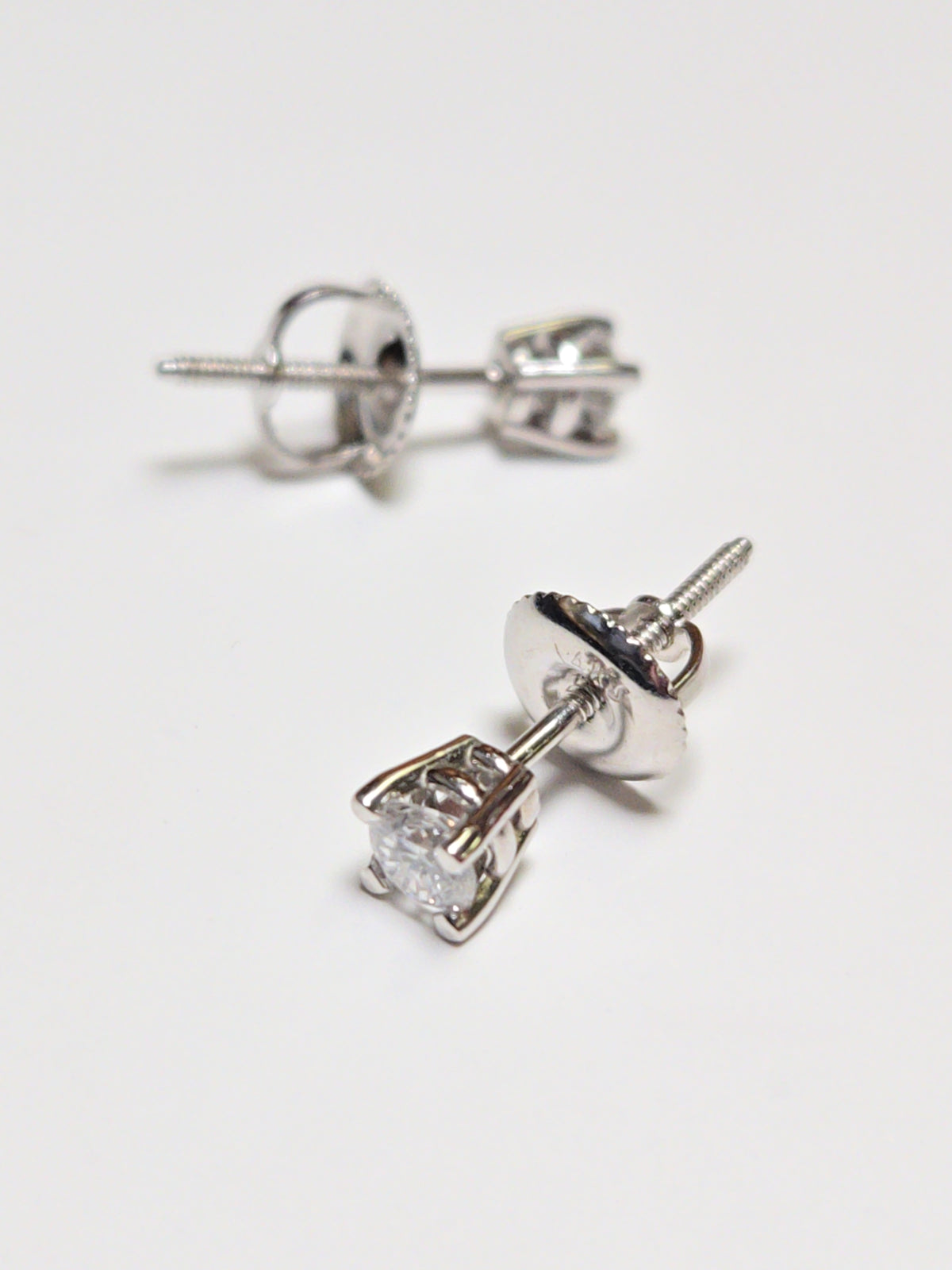 14K white gold stud earrings with 0.3ct round lab-created diamonds, featuring a sleek and elegant design by Chique Jewelry.