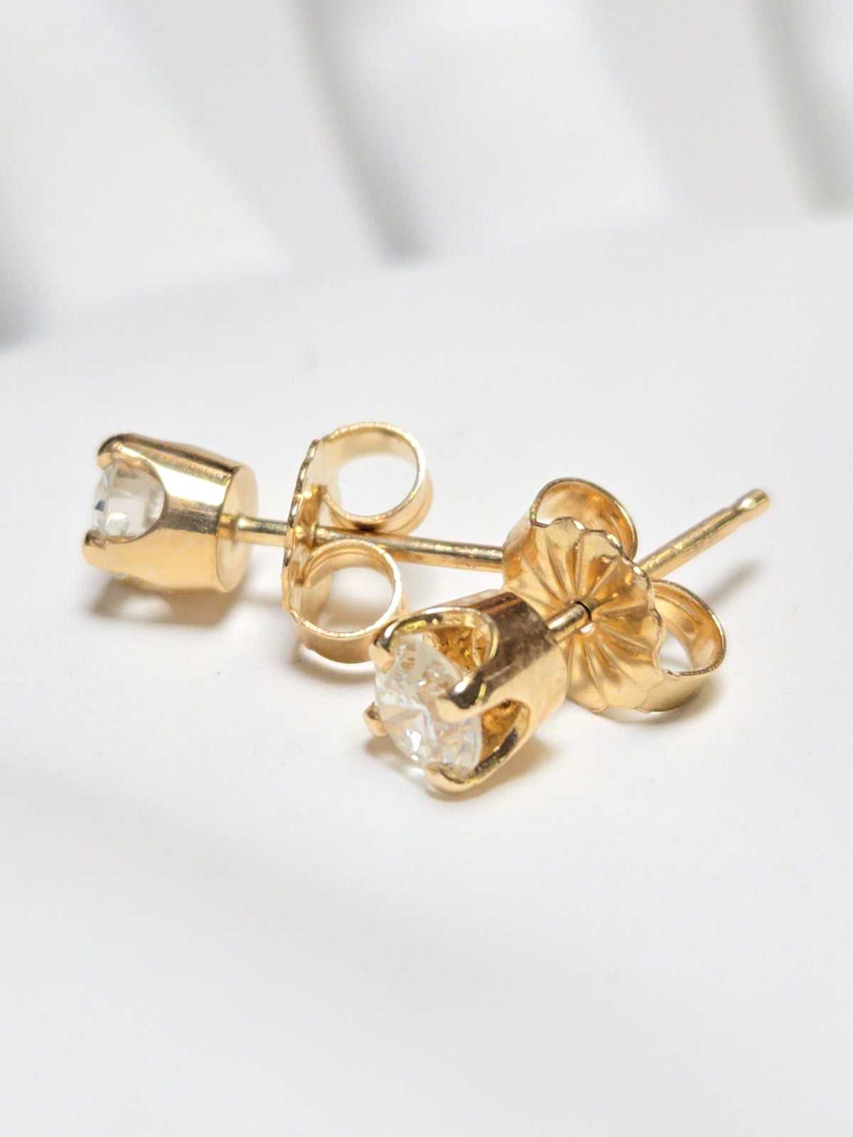 14K gold stud earrings featuring 0.48ct round diamonds, from Chique Jewelry, showcasing elegant jewelry design.