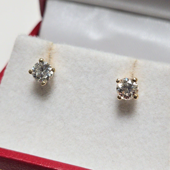 14K gold stud earrings with 0.5ct round diamonds from Chique Jewelry, featuring a simple and elegant design.
