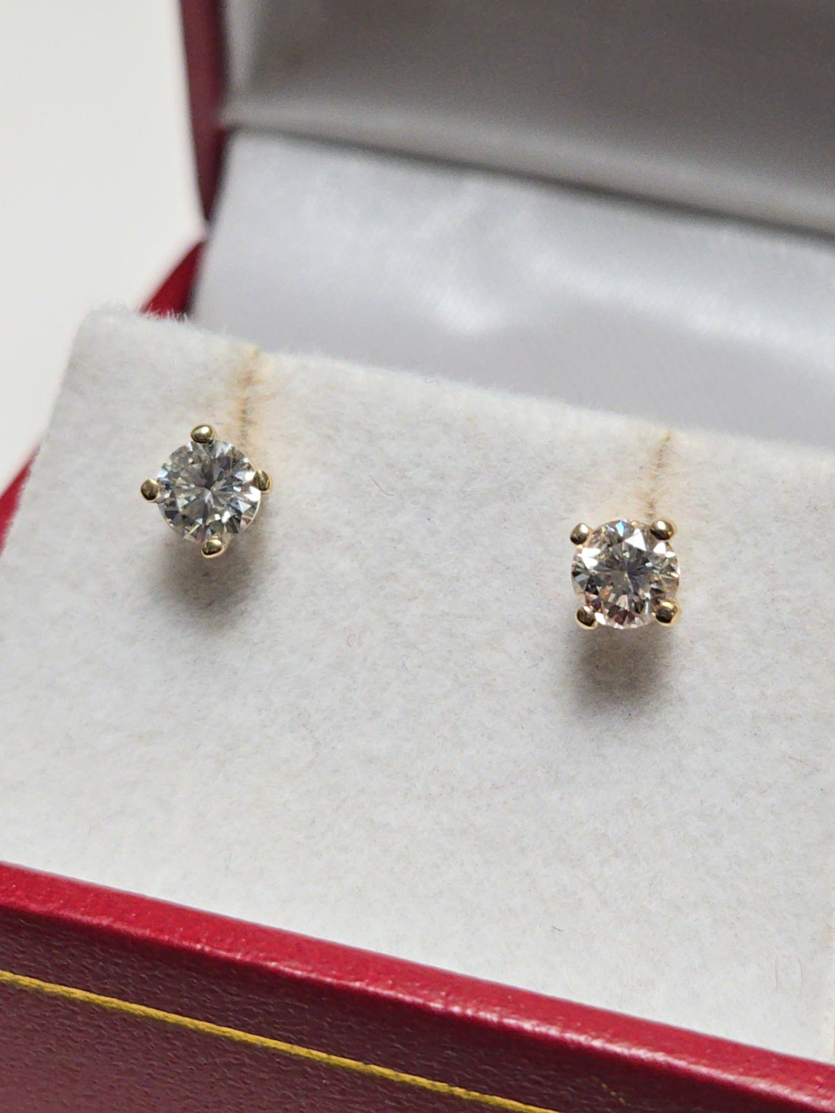 14K gold stud earrings with 0.5ct round diamonds from Chique Jewelry, featuring a simple and elegant design.