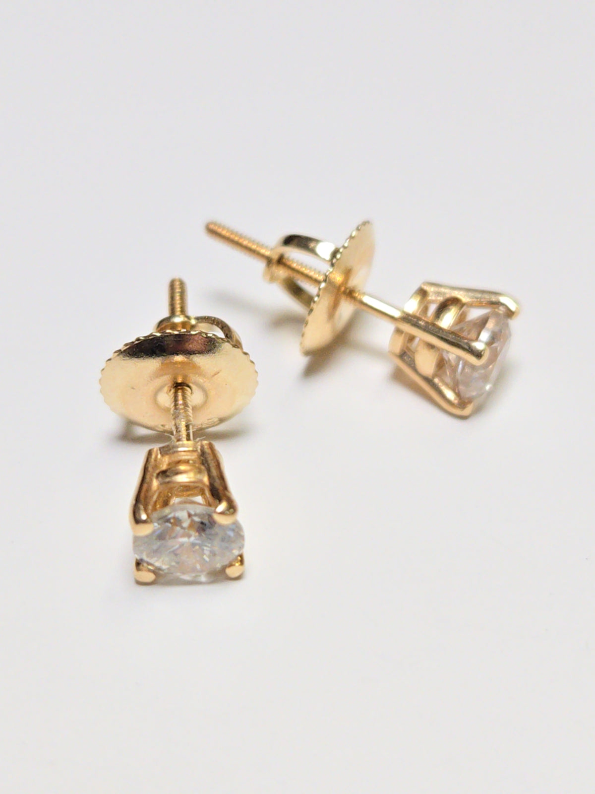 14K gold stud earrings with 0.5ct round diamonds from Chique Jewelry, showcasing elegant jewelry design.
