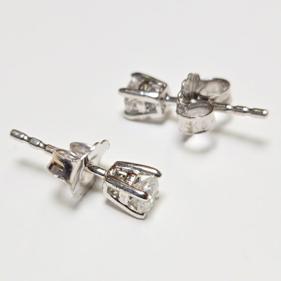 14K white gold stud earrings with 0.24ct round lab-created diamonds, featuring a sleek design and sparkling brilliance.