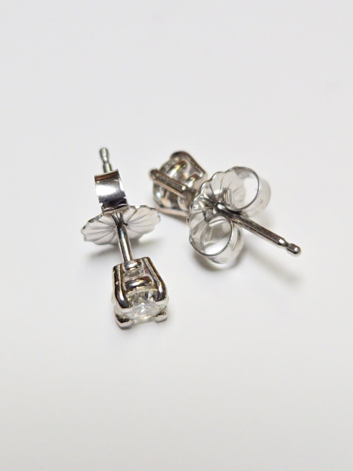 14K white gold stud earrings with 0.36ct round diamonds, showcasing elegant jewelry craftsmanship by Chique Jewelry.
