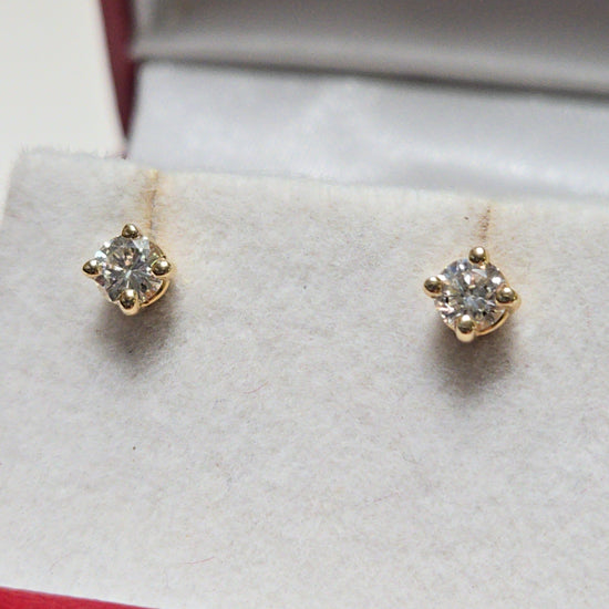 14K gold stud earrings with 0.34ct round diamonds, featuring a simple and elegant design by Chique Jewelry.
