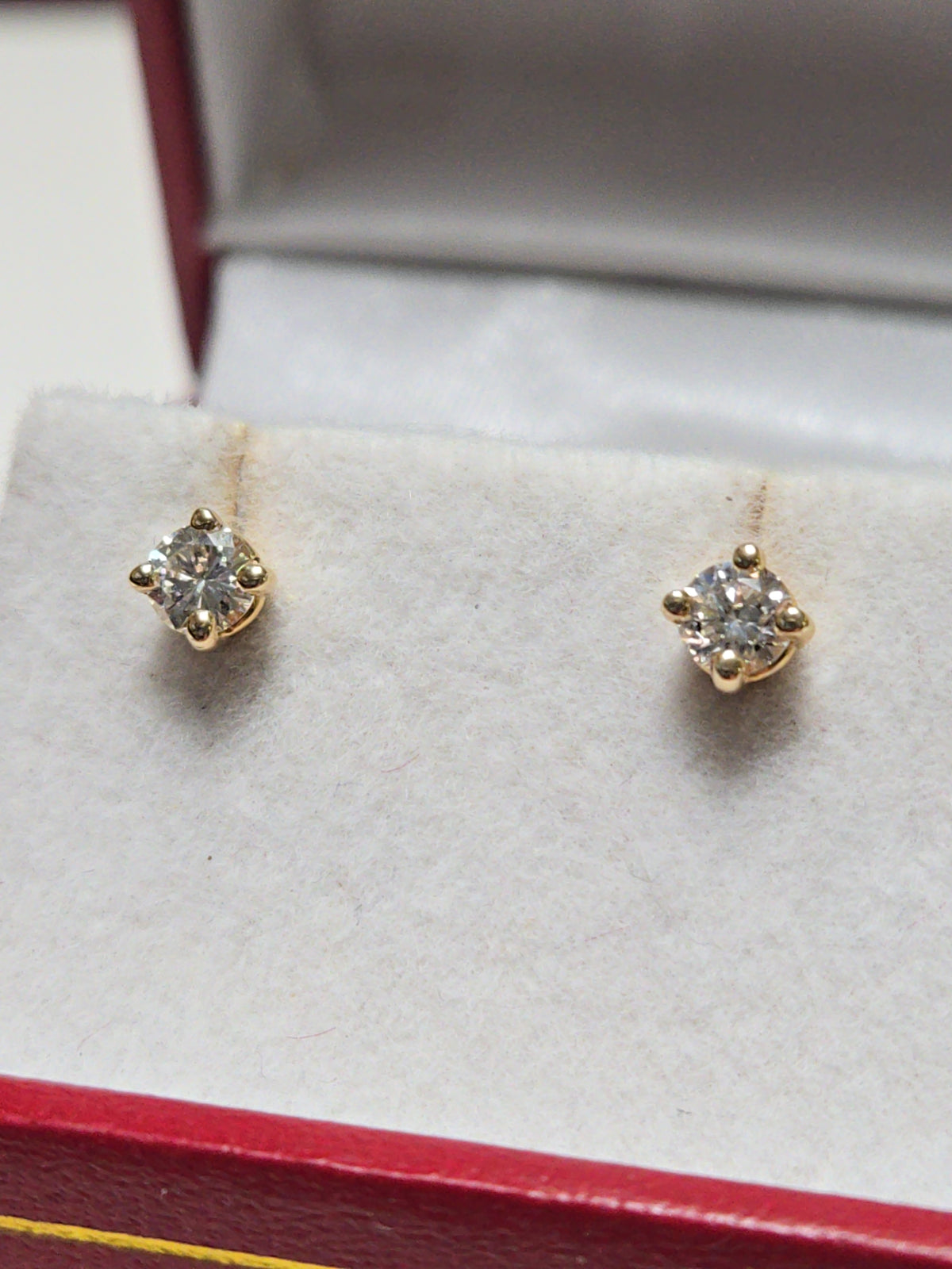 14K gold stud earrings with 0.34ct round diamonds, featuring a simple and elegant design by Chique Jewelry.