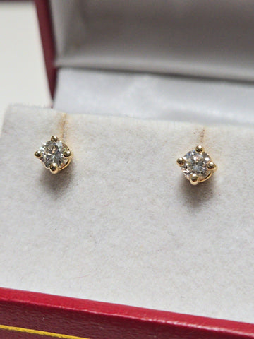 14K gold stud earrings with 0.34ct round diamonds, featuring a simple and elegant design by Chique Jewelry.