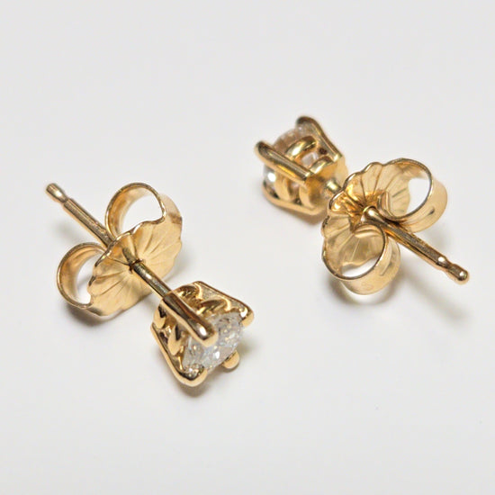 14K gold stud earrings with 0.34ct round diamonds from Chique Jewelry, showcasing classic and elegant jewelry design.