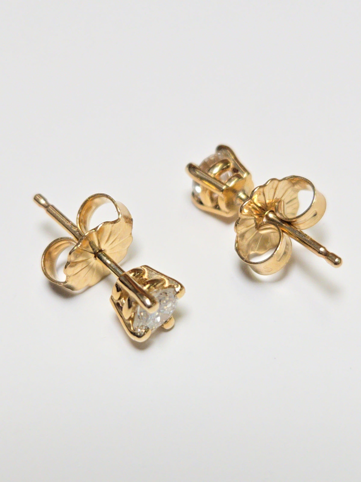 14K gold stud earrings with 0.34ct round diamonds from Chique Jewelry, showcasing classic and elegant jewelry design.