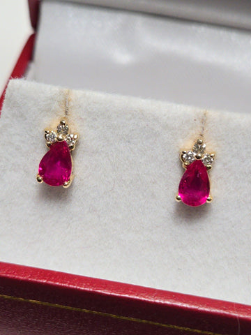 14K gold stud earrings featuring a 0.9ct pear-shaped ruby, crafted by Chique Jewelry, displayed on a clean background.