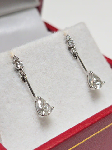 14K white gold drop earrings with 0.38ct pear-shaped diamond and delicate design by Chique Jewelry.